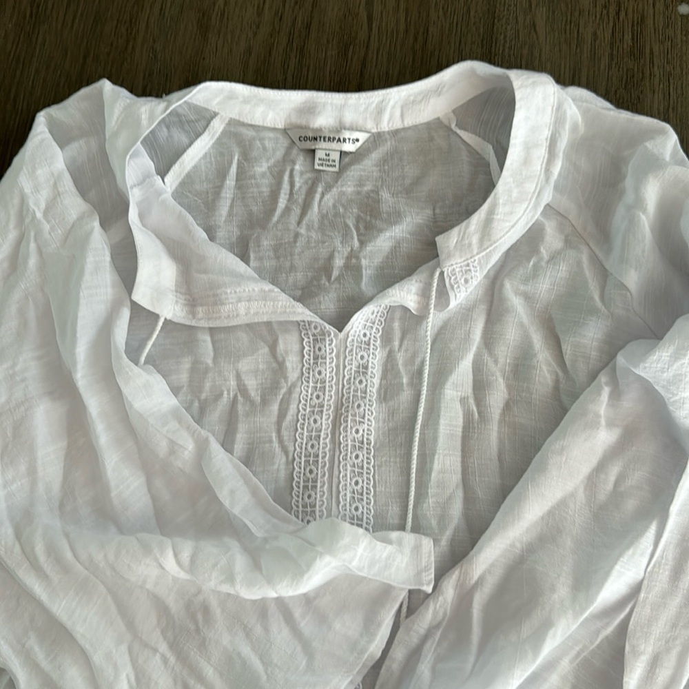 Counterparts size M. Brand new with tags. No stretch. See thru